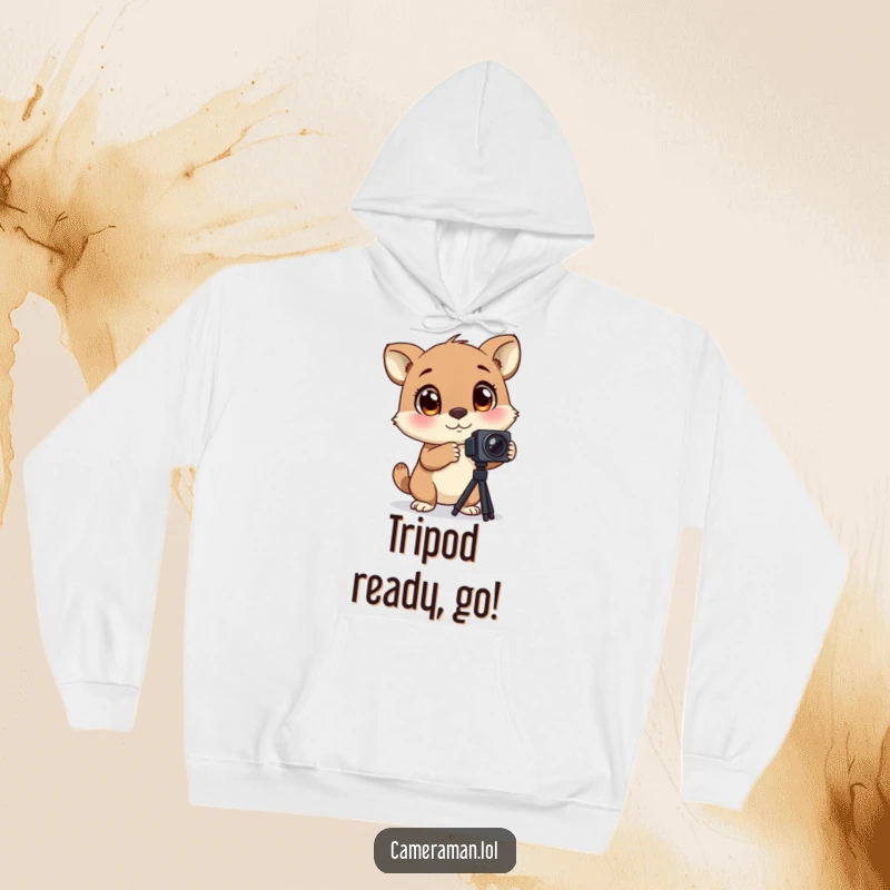 Funny hoodie of an animal with large, blinking eyes, excitedly adjusting a camera tripod, perfect for cozy, enthusiastic moments.