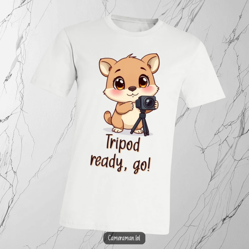 Funny t-shirt featuring an animal with large, blinking eyes, excitedly adjusting a camera tripod, showcasing eager photography.